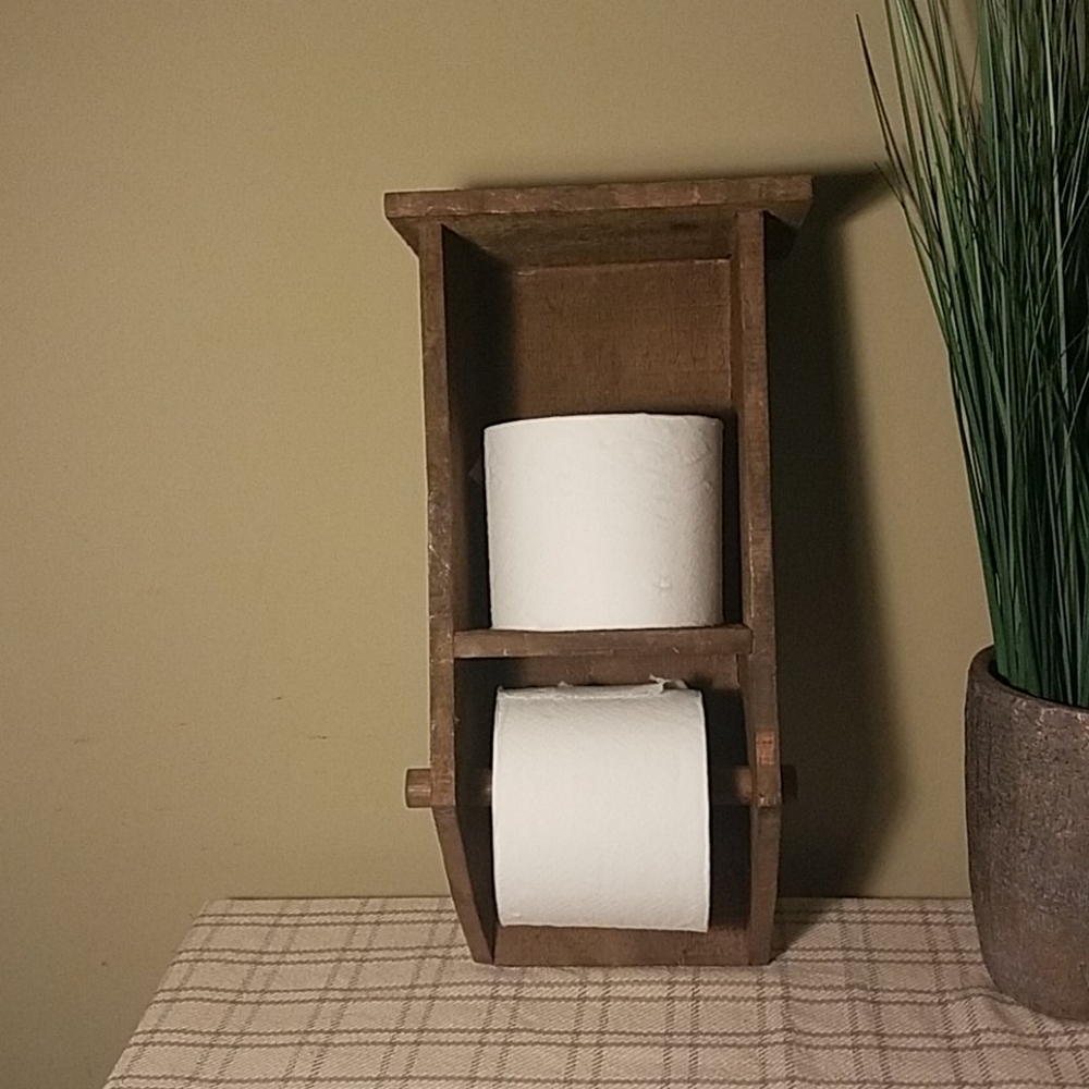 Wood toilet paper holder with shelf.